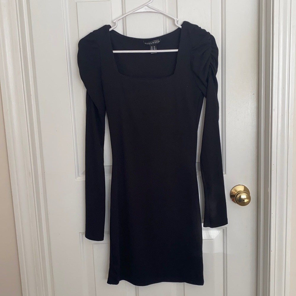 Simple black dress with detailing on shoulders